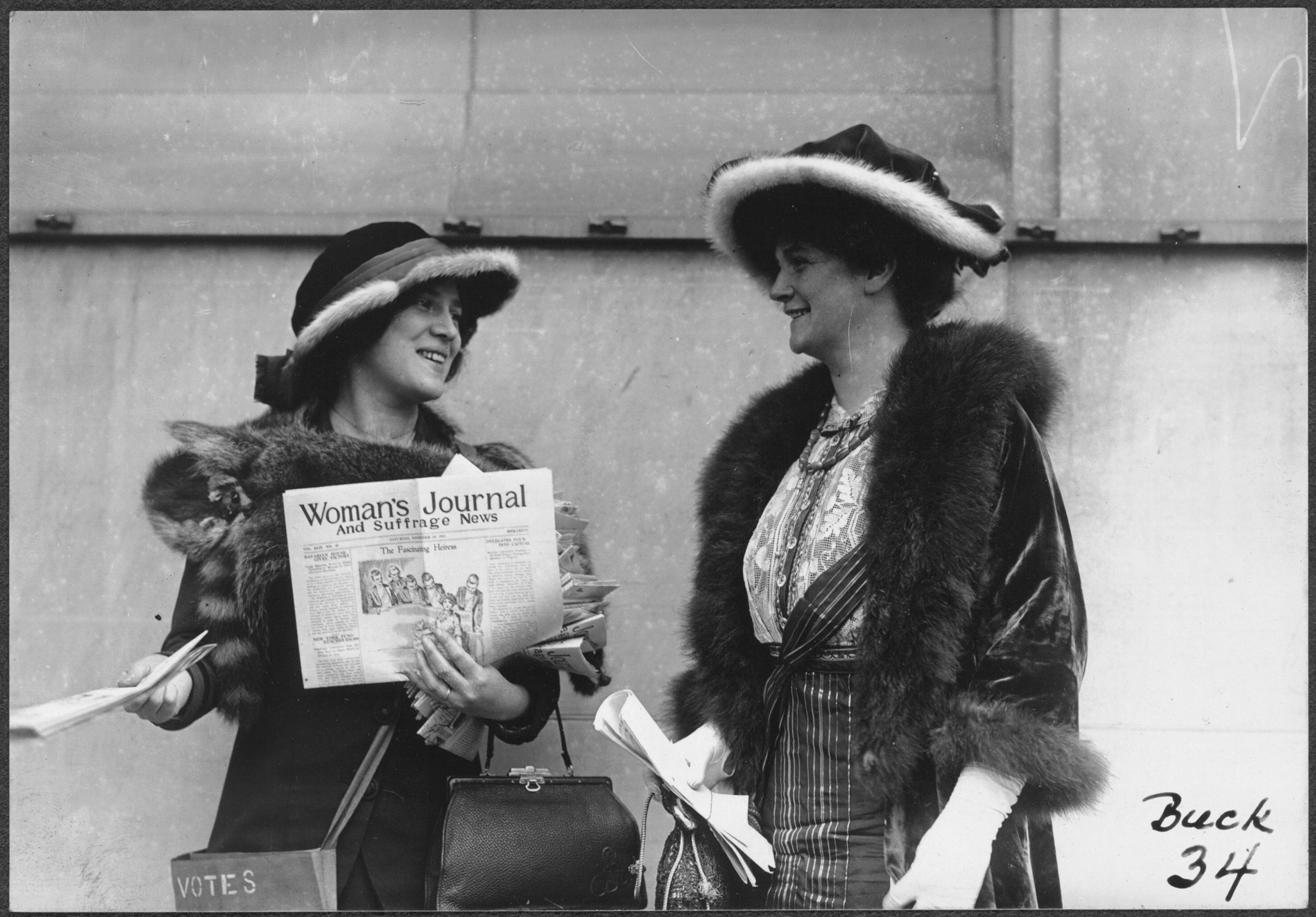 Suffragist Margaret Foley distributing the Woman's Journal and Suffrage News, 1913